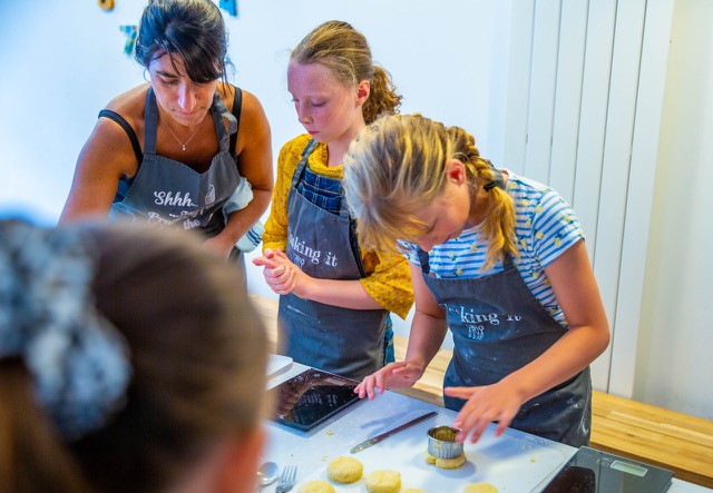 Monica Worsley teaching kids to cook at cookery school Cooking It